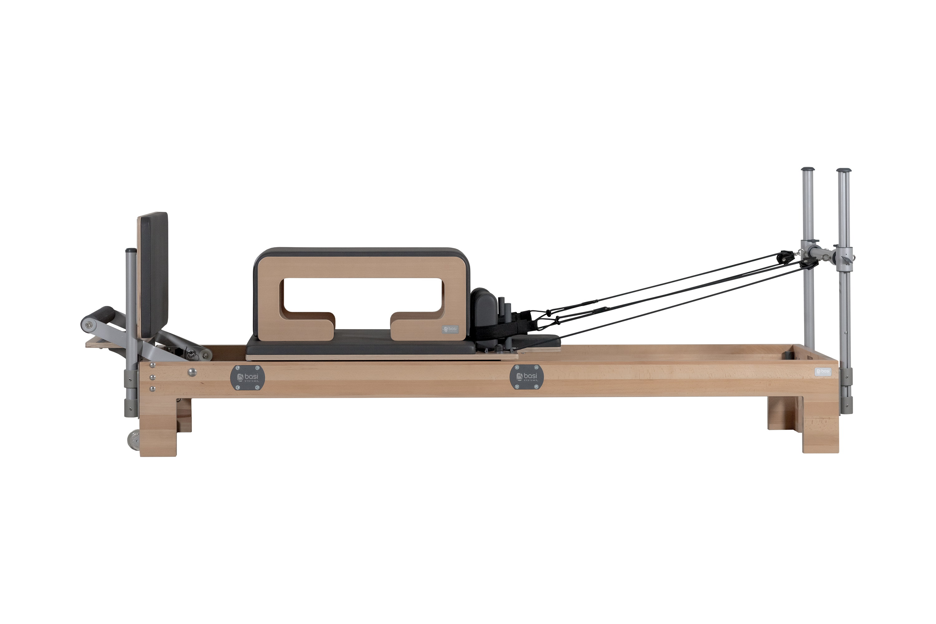 Reformer: tấm trượt carriage, thanh để chân và bộ lò xo — dụng cụ nền của Pilates trên thiết bị
